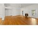 Spacious living room with hardwood floors, fireplace and multiple entryways at 406 N Wakefield St, Zebulon, NC 27597