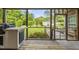 Outdoor living space with grilling area and views of the lush backyard at 406 N Wakefield St, Zebulon, NC 27597