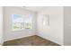 Bright dining area features a large window, wood-look floors, and open design for a seamless living experience at 408 Ember St, Sanford, NC 27330