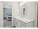 Bathroom vanity featuring a white countertop, cabinetry and a mirror at 409 Summit Trail Dr, Hillsborough, NC 27278