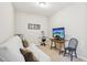 Cozy bedroom setup with futon, TV, and small workout equipment at 409 Summit Trail Dr, Hillsborough, NC 27278