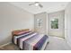Cozy bedroom with a ceiling fan and two windows with tree views at 409 Summit Trail Dr, Hillsborough, NC 27278