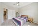 Cozy bedroom with a ceiling fan, a wood bed frame, and two nightstands at 409 Summit Trail Dr, Hillsborough, NC 27278