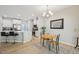 Dining area with island seating and views of the adjacent modern kitchen space at 409 Summit Trail Dr, Hillsborough, NC 27278
