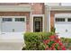 Close-up of the front entrance with a black door and landscaped garden at 409 Summit Trail Dr, Hillsborough, NC 27278