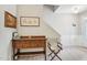 Inviting entryway featuring hardwood floors, decorative artwork, and a charming wooden console table at 409 Summit Trail Dr, Hillsborough, NC 27278