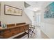 Inviting entryway featuring hardwood floors, decorative artwork, and a charming wooden console table at 409 Summit Trail Dr, Hillsborough, NC 27278