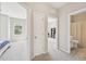 Bright hallway offers views into the bedroom and bathroom at 409 Summit Trail Dr, Hillsborough, NC 27278