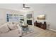 Bright living room with fireplace, large windows, and stylish neutral decor at 409 Summit Trail Dr, Hillsborough, NC 27278