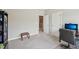 Bright home office, showing a rear view of an office chair and a bookcase at 409 Summit Trail Dr, Hillsborough, NC 27278