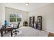 Bright home office featuring a large window, built-in bookshelves, and carpeted floor at 409 Summit Trail Dr, Hillsborough, NC 27278