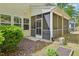 The charming screened porch creates a seamless indoor-outdoor living experience with ample natural light at 409 Summit Trail Dr, Hillsborough, NC 27278