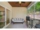 Inviting screened porch with a comfortable seating area and ceiling fan for relaxing outdoors at 409 Summit Trail Dr, Hillsborough, NC 27278