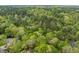 Aerial view of a wooded lot with mature trees and vegetation at 4120 Picardy Dr, Raleigh, NC 27612