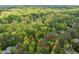 Aerial view of a wooded lot with a red boundary line at 4120 Picardy Dr, Raleigh, NC 27612