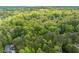 Aerial view of a wooded lot with mature trees at 4120 Picardy Dr, Raleigh, NC 27612