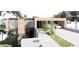 Stunning modern home featuring wood siding, large windows, and covered parking at 4120 Picardy Dr, Raleigh, NC 27612