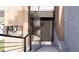 Contemporary home entrance with stone stairs, steel railing and wood accent siding at 4120 Picardy Dr, Raleigh, NC 27612