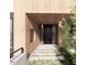 Modern home entrance featuring wood siding and walkway to the front door at 4120 Picardy Dr, Raleigh, NC 27612
