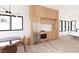 Stylish kitchen with stainless steel refrigerator, wood cabinets, and modern light fixture at 4120 Picardy Dr, Raleigh, NC 27612