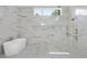 Bright bathroom featuring a soaking tub and luxurious marble shower at 4139 Rockingham Dr, Raleigh, NC 27609