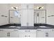 Stylish bathroom with a double vanity, modern fixtures, and ample storage at 4139 Rockingham Dr, Raleigh, NC 27609