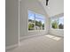 Bright bedroom featuring vaulted ceilings and large windows with wooded views at 4139 Rockingham Dr, Raleigh, NC 27609