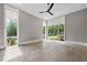 Bright, airy bedroom with hardwood floors, recessed lighting, and multiple windows offering a view of lush backyard landscaping at 4139 Rockingham Dr, Raleigh, NC 27609