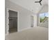Bedroom with vaulted ceiling, large window, carpet, and closet with shelving at 4139 Rockingham Dr, Raleigh, NC 27609