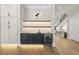 Stylish butler's pantry with elegant cabinetry, shelving, and a beverage center at 4139 Rockingham Dr, Raleigh, NC 27609