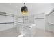Spacious walk-in closet with custom shelving, drawers, and a center island at 4139 Rockingham Dr, Raleigh, NC 27609