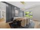 Elegant dining room features modern lighting, stylish decor, and a view of the landscaped surroundings at 4139 Rockingham Dr, Raleigh, NC 27609