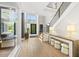 Grand entrance with high ceilings, statement lighting, and open staircase at 4139 Rockingham Dr, Raleigh, NC 27609