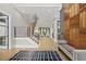 Spacious foyer with modern staircase, wood accent wall, and hardwood floors at 4139 Rockingham Dr, Raleigh, NC 27609