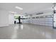 Spacious garage with vehicle lift and ample room for storage or hobbies at 4139 Rockingham Dr, Raleigh, NC 27609