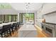 Bright kitchen with a large island, stainless steel appliances, and sliding glass doors to the backyard at 4139 Rockingham Dr, Raleigh, NC 27609