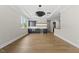 Open-concept living room featuring hardwood floors, wet bar, and recessed lighting at 4139 Rockingham Dr, Raleigh, NC 27609