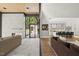 Open-concept living space with transition to kitchen, fireplace, and outdoor space offering a blend of modern living at 4139 Rockingham Dr, Raleigh, NC 27609