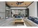 Sophisticated living area with stone floors, modern fireplace, and stylish furniture overlooking the outdoors at 4139 Rockingham Dr, Raleigh, NC 27609
