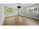 Spacious living room featuring hardwood floors, recessed lighting, and large windows at 4139 Rockingham Dr, Raleigh, NC 27609