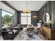 Stylish home office with natural light, modern decor, and comfortable seating for a productive workspace at 4139 Rockingham Dr, Raleigh, NC 27609