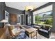 Well-lit home office featuring modern decor, a sleek desk, and a comfortable workspace with ample natural light at 4139 Rockingham Dr, Raleigh, NC 27609