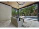 Inviting outdoor living space with comfortable seating and a view of the pool at 4139 Rockingham Dr, Raleigh, NC 27609