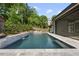 Modern pool and patio area, perfect for relaxation, featuring a sleek design and lush landscaping at 4139 Rockingham Dr, Raleigh, NC 27609