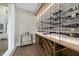 Modern wine cellar with sleek display racks and ambient lighting at 4139 Rockingham Dr, Raleigh, NC 27609