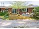 Spacious backyard deck featuring outdoor seating and a beautifully landscaped area creating a serene outdoor oasis at 449 Hill Rd, Franklinton, NC 27525