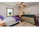 Comfortable bedroom with two beds and a window overlooking the outdoor landscape at 449 Hill Rd, Franklinton, NC 27525