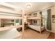 Bedroom with bunk beds, carpeted floor, a study desk, and windows with view of greenery at 449 Hill Rd, Franklinton, NC 27525