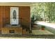 Brick home entrance with steps, black railing, and a partially covered porch at 449 Hill Rd, Franklinton, NC 27525