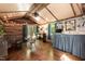 Interior showcasing hardwood floors, a fireplace, a kitchenette, and bright curtains at 449 Hill Rd, Franklinton, NC 27525